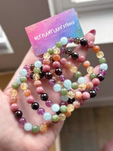 Load image into Gallery viewer, Ostara - 8mm Garnet, Rhodonite, Sunstone, Citrine, Green Apatite, Aquamarine, Purple Fluorite, Smoky Quartz Gemstone Stretch Mala Bracelet