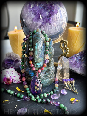 Ganesha’s Garden - Rhodonite, Hematoid Amethyst, Golden Rutile Quartz, Ruby Fuchsite - Amethyst Focal - 108 Mala Bead Necklace
