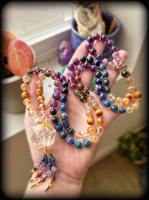 Solara Liora - Double Terminated Golden Healer Quartz Focal - 108 Mala Necklace - Diamond cut Lapis & Garnet tassel