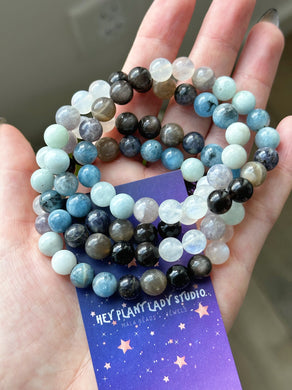 Ocean’s Depths - Aquamarine, Devil Blue Aquamarine, Grey Sunstone, Rainbow Moonstone, Silver Obsidian, Dark Blue & Light Blue Iolite. Gemstone Bracelet