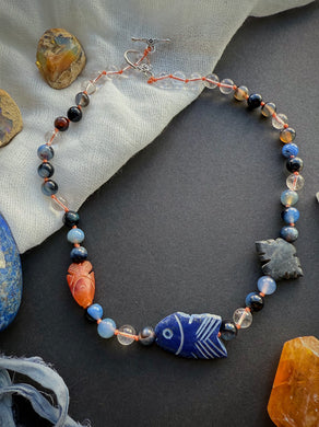 Piscean Relic - 16” Choker - 8mm Clear Quartz, Stormline Agate - Carnelian Fish, Onyx Carving, Lapis Lazuli Fish