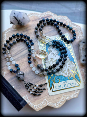 Selenophile - Tourmalinated Quartz Focal - 8mm: large facet deep teal Apatite, faceted onyx, faceted larvikite, faceted agate, grey moonstone - 108 Mala Necklace - Diamond cut tassel