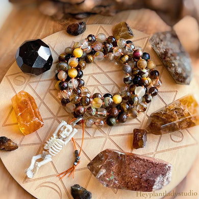 Glowing Embers Mala Necklace - 108 Fire Quartz + Gold Aura Quartz + Tigers Eye + Bronzite Olivin +Hand Carved Buffalo Bone Skeleton