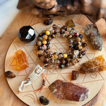 Load image into Gallery viewer, Glowing Embers Mala Necklace - 108 Fire Quartz + Gold Aura Quartz + Tigers Eye + Bronzite Olivin +Hand Carved Buffalo Bone Skeleton