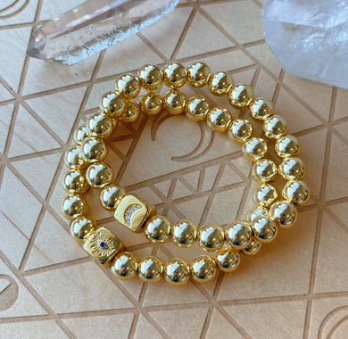 Stay Golden - 8mm Gold Hematite + 18K Gold Plated Lucky Symbols Charm- Stretch Bracelet