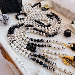 Golden Glamour - Antique Gold Buddha Coin, 24K Gold Black Feather Tassel, Mystic Rose Quartz, Dalmatian Jade, Black Tourmaline, Freshwater Pearls