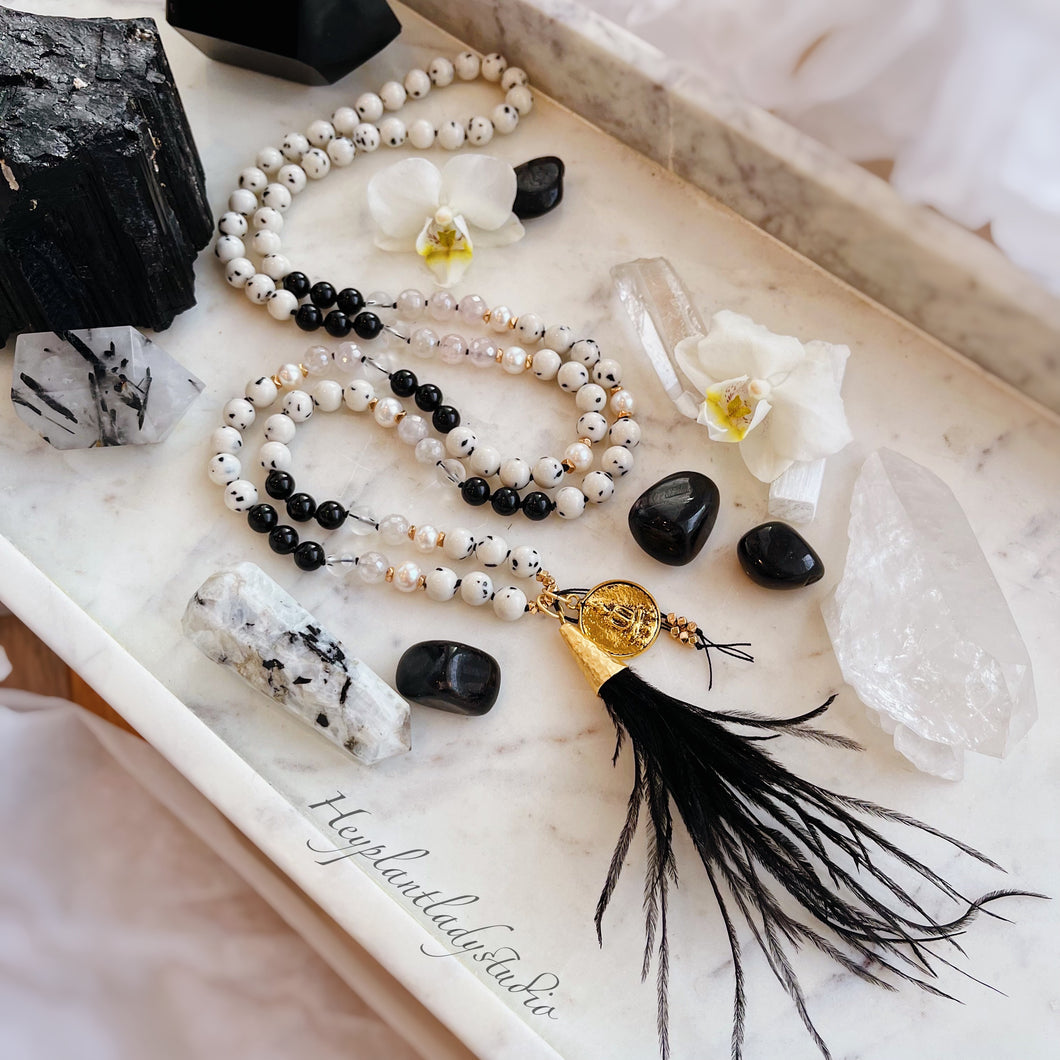 Golden Glamour - Antique Gold Buddha Coin, 24K Gold Black Feather Tassel, Mystic Rose Quartz, Dalmatian Jade, Black Tourmaline, Freshwater Pearls