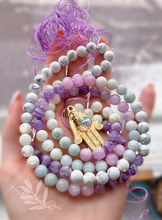 Load image into Gallery viewer, Angelic Guidance - Kunzite, Jade, Dream Amethyst, Mother of Pearl, &amp; Howlite 108 Mala Bead Necklace - 24k Gold Overlay Hamsa + 24K Gold Aura Quartz