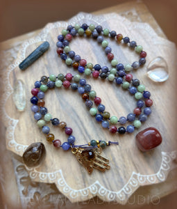 Integration of Heart & Mind - Tanzanite, Sapphire, Ruby, Iolite 108 Mala Bead Necklace - 24k Gold Overlay Hamsa + 24K Gold Smoky Quartz Briolette + Kyanite Accents