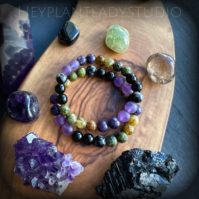 Winds of Change - Mystic Merlinite + Lepidolite + Green Garnet + Amethyst + Onyx Gemstone Stretch Mala Bracelet