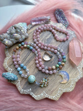 Load image into Gallery viewer, Sunset Reflections - 108 Mala Bead Necklace - AAA Clear Quartz, Aura Rose Quartz, Lavender Amethyst, Aquamarine, Grossular Garnet, Peach Moonstone, Golden Mother of Pearl, Aura Quartz