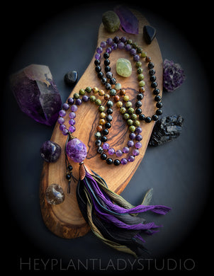 Winds of Change Mala Necklace - Mystic Merlinite + Lepidolite + Amethyst + Epidote + Green Garnet + Onyx + Prehnite + Gem Cut Ametrine Guru + Hand Dyed Silk Tassel